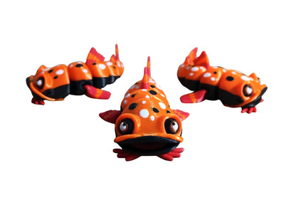 3D-printed articulated catfish fidget toys, designed by FlexiFactory. AND it's designed to float!