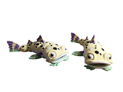 3D-printed articulated catfish fidget toys, designed by FlexiFactory. AND it's designed to float!